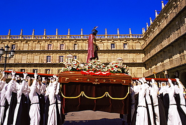 Penitents lifting the Jesus Christ carriage during Semana Santa (Holy Week) procession, Salamanca, Castilla y Leon (Old Castile), Spain, Europe