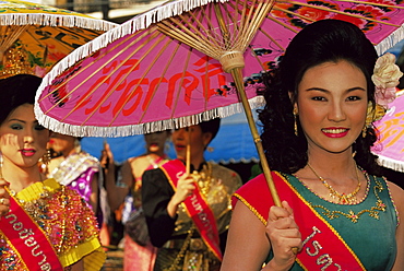 Thai queens holding typical umbrellas during King Narai Reign Fair, festival held in Lopburi, Thailand, Southeast Asia, Asia