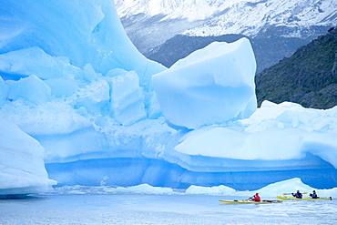 People kayaking near floating icebergs, Lago Gray (Lake Gray), Torres del Paine National Park, Patagonian Andes, Patagonia, Chile, South America