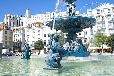 Rossio Square (Praca Dom Pedro IV) and Carmo church in background, Lisbon, Portugal, Europe