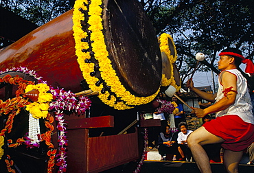 Young Thai man playing drums in parade, Flowers Festival, Chiang Mai, Thailand, Southeast Asia, Asia