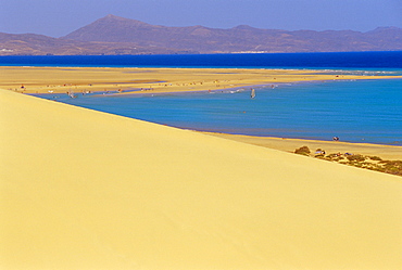 Sandy dunes and Peninsula de Gandia in the background, View of the Coastline near Tiscamanita, Fuerteventura, Canary Islands, Spain 