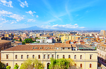 Elevated view of the town with Etna volcano in the distance, Catania, Sicily, Italy