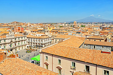 Elevated view of the town with Etna volcano in the distance, Catania, Sicily, Italy