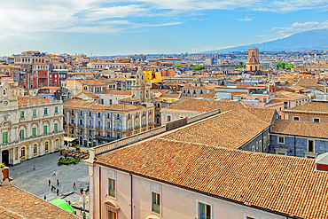 Elevated view of the town with Etna volcano in the distance, Catania, Sicily, Italy