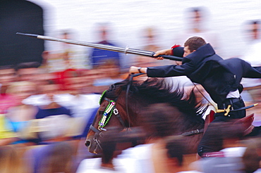 Horse rider jousting with target during the Sant Joan's festival, Ciutadella, Minorca, Spain