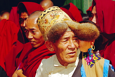 Old Tibetan man wearing typical hat during Losar (Tibetan New Year), Bodhnath, Katmandu, Nepal