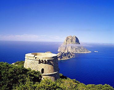 View of defence tower and the rocky island of Es Vedra, near Sant Antoni, Ibiza, Balearic Islands, Spain, Mediterranean, Europe
