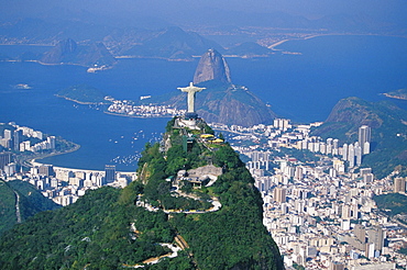 Aerial view of Rio de Janeiro with the Cristo Redentor (Christ the Redeemer) in the foreground and the Pao de Acucar (Sugar Loaf) in the background, Rio de Janeiro, Brazil, South America