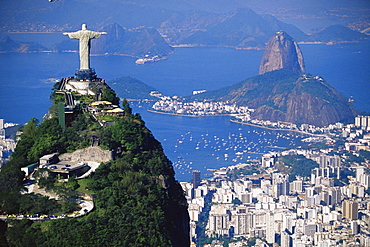 Statue of Christ the Redeemer overlooking city and Sugar Loaf mountain, Rio de Janeiro, Brazil, South America