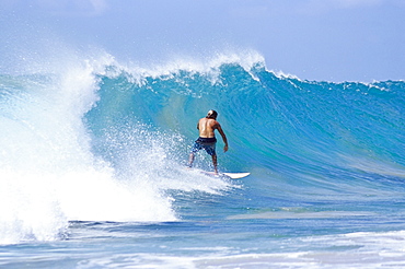 Man surfing at Praia do Boldro, Parque Nacional de Fernando de Norohna, Fernando de Noronha, Pernambuco, Brazil, South America