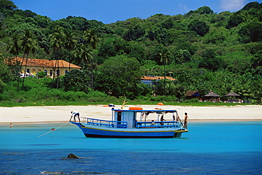 Fishing boat at Praia da Conceicao, Parque Nacional de Fernando de Norohna, Fernando de Noronha, Pernambuco, Brazil, South America