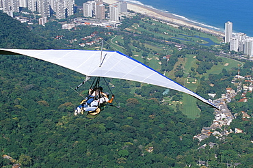 Hang-glider after taking off from Pedra Bonita, Rio de Janeiro, Brazil, South America