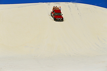 Beach buggy riding on the sandy dunes of the Ceara' coastline, near Canoa Quedrada, Ceara, Brazil, South America