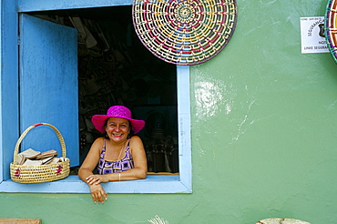 Hat seller at the window of her shop, Parque Nacional dos Lencois Maranhenses, Brazil, South America