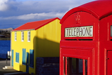 British red telephone box and colourful traditional house, Stanley, East Falkland, Falkland Islands, South Atlantic, South America