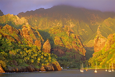 Coastal scenery and boats, Bay of Virgins, Hanavave, Fatu Iva island, Marquesas Islands archipelago, French Polynesia, South Pacific Islands, Pacific