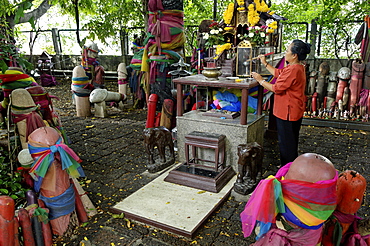 Formerly built to re-house the spirit from the ficus tree, donations of phallic symbols have resulted in the shrine being dedicated to fertility, Chao Mae Tuptim (Shrine of the Goddess Tuptim), Bangkok, Thailand, Southeast Asia, Asia