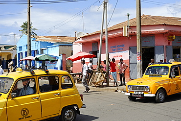 Yellow taxi. Antsiranana (Diego-Suarez), northern tip of the island, Diana Region. Madagascar, Africa