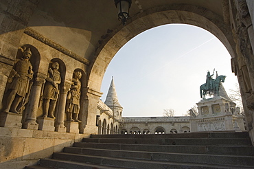 Sunset ight on St Stephens Statue, Castle Hill area, Budapest, Hungary, Europe