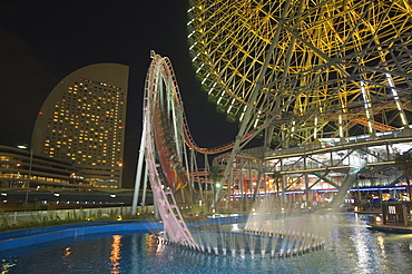 Rollercoaster and fun fair amusement park at night, Minato Mirai, Yokohama, Japan, Asia