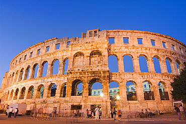 The 1st century Roman amphitheatre bathed in early evening light, Pula, Istria Coast, Croatia, Europe