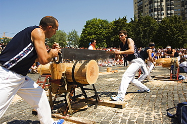 Log cutting strong man competition, during San Fermin, Running of the Bulls Festival, Pamplona, Navarra, Euskadi, Spain, Europe