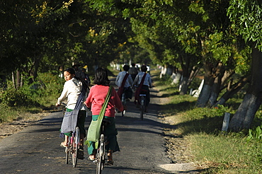 Cycling to school, Inle Lake,Shan State, Myanmar (Burma), Asia