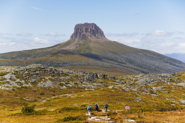 Hikers walking towards Barn Bluff on the overland track in Cradle Mountain Lake St. Clair National Park, part of Tasmanian Wilderness, UNESCO World Heritage Site, Tasmania, Australia, Pacific