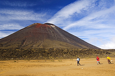 Hikers in front of Mount Ngauruhoe, 2287m, on the Tongariro Crossing, in the oldest national park in New Zealand, Tongariro National Park, UNESCO World Heritage Site, Taupo, North Island, New Zealand, Pacific