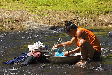 Man washing clothes in river, Sagada Town, The Cordillera Mountains, Benguet Province, Luzon, Philippines, Southeast Asia, Asia