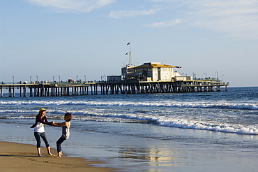 Girls enjoying the seaside near Santa Monica Pier, Santa Monica Beach, Los Angeles, California, United States of America, North America