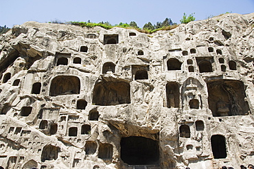 Carved Buddha images at Longmen Caves, Dragon Gate Grottoes, dating from the 6th to 8th Centuries, UNESCO World Heritage Site, Henan Province, China, Asia