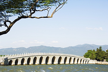 Seventeen Arch Bridge on Kunming Lake built in 1750 during Emperor Qialong's reign leads to South Lake Island, Yihe Yuan (The Summer Palace), UNESCO World Heritage Site, Beijing, China, Asia