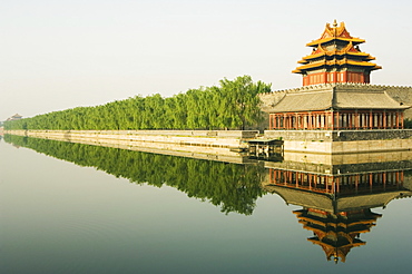 A reflection of the Palace Wall Tower in the moat of The Forbidden City Palace Museum, UNESCO World Heritage Site, Beijing, China, Asia