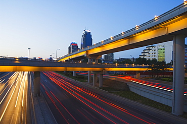 Car light trails and modern buildings near Beijing North Train Station, Xizhimen district, Beijing, China, Asia