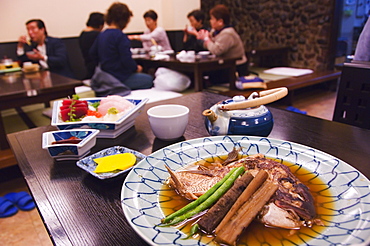 Traditional Japanese meal of sushi and fish head, Tokyo, Honshu Island, Japan, Asia