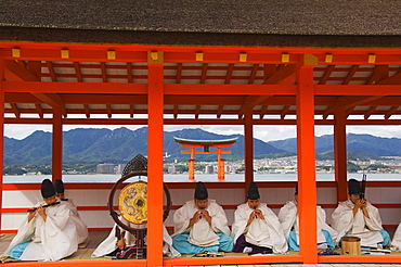 A Wedding Ceremony musical performance in front of the Floating Torii Gate at Itsukushima Shrine, founded in 593, UNESCO World Heritage Site, Miyajima Island, Hiroshima prefecture, Honshu Island, Japan, Asia