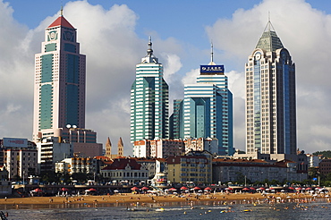 Modern skyscrapers in the seaside beach resort and host of the sailing events of the 2008 Olympic Games, Qingdao, Shandong Province, China, Asia