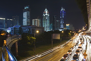 Car light trails and illuminated buildings on Peoples Square, Shanghai, China, Asia