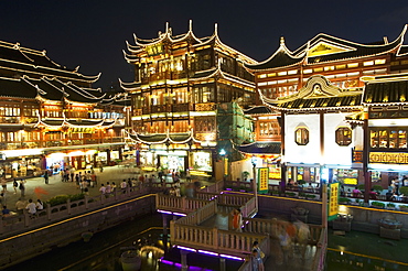 Yuyuan (Yu yuan) Garden Bazaar buildings founded by Ming dynasty Pan family illuminated in the Old Chinese city district, Shanghai, China, Asia