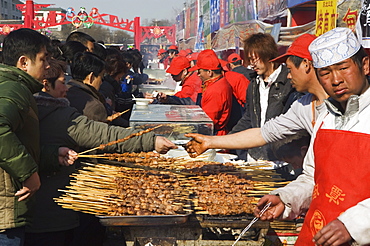 Food stalls selling meat sticks at Changdian Street Fair during Chinese New Year, Spring Festival, Beijing, China, Asia