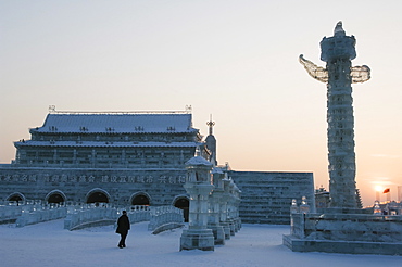 Sunset and replica Forbidden City ice sculpture at the Ice Lantern Festival, Harbin, Heilongjiang Province, Northeast China, China, Asia