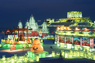 Snow and ice sculptures illuminated at night at the Ice Lantern Festival, Harbin, Heilongjiang Province, Northeast China, China, Asia