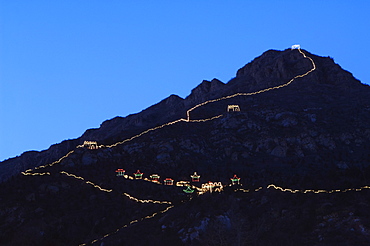 A display of night time illuminations and copy of the Great Wall of China at Longqing Gorge Ice sculpture festival, Beijing, China, Asia