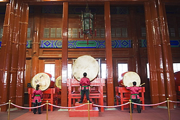 Drummers inside The Drum Tower, a later Ming dynasty version originally built in 1273 marking the centre of the old Mongol capital, Beijing, China, Asia