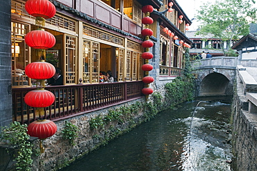 Traditional architecture of riverside restaurant in Lijiang Old Town, Lijiang, UNESCO World Heritage Site, Yunnan Province, China, Asia