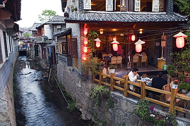 Traditional architecture of riverside restaurant in Lijiang Old Town, Lijiang, UNESCO World Heritage Site, Yunnan Province, China, Asia