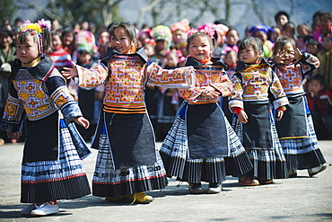 Girls in ethnic costume at a 4 Seals Miao lunar New Year festival, Xinyao village, Guizhou Province, China, Asia