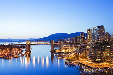 Illuminated buildings in False Creek Harbour, Vancouver, British Columbia, Canada, North America